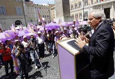 AP - Robert Torricelli, a former United States senator from New Jersey, addresses supporters in Rome in front of the Italian Parliament, Wednesday, July 6, 2011. The majority members of the Italian Parliament declared their support for residents of Ashraf, where 3,400 Iranian dissidents are located in Iraq, and condemned the massacre by Iraqi forces of Ashraf residents last April 8. (AP Photo/Andrew Medichini)