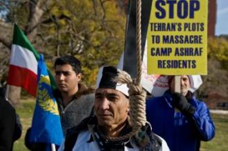 AFP &ndash; A protestor wears a noose as others wave Iranian flags during a demonstration to demand the continued US protection of 3,500 members of Iran's opposition People's Mojahedin of Iran (PMOI/MEK) at Camp Ashraf in Iraq's Diyala province, some 40 miles (65km) north of Baghdad, in Washington, DC on December 5, 2008. Supporters of PMOI/MEK say the transfer of protection to the Iraqi government would put members at grave risk.