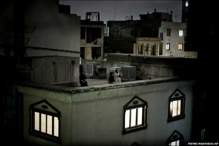 Chants of 'death to Khamenei' and 'death to dictator' echo on Tehran rooftops on anniversary of Khom