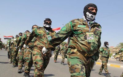 Militias-of-al-Hashd-al-Shaabi-Popular-Mobilization-Forces-march-during-a-military-parade-in-Baghdad-Iraq-on-July-10-2015-Getty-Images