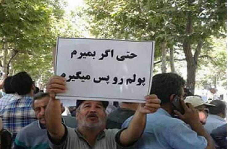 man-holding-slogan-iran