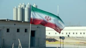 iran-flag-bushehr-nuclear-site-min