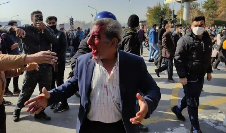 FILE PHOTO: Injured man after security forces cracked down on protests over the Zayandeh Rud River blockage in Isfahan, November 26, 2021