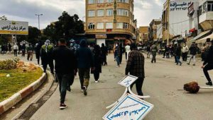 iran-uprising-man-board iran-uprising-man-board