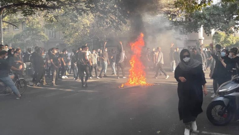 iran-uprising-youth-fire-1