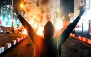Iran protests fire victory sign Iran protests fire victory sign