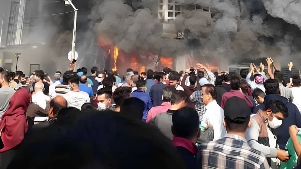 A widely recognized image from the November 2019 uprising showing a bank in flames near Tehran, Iran's capital