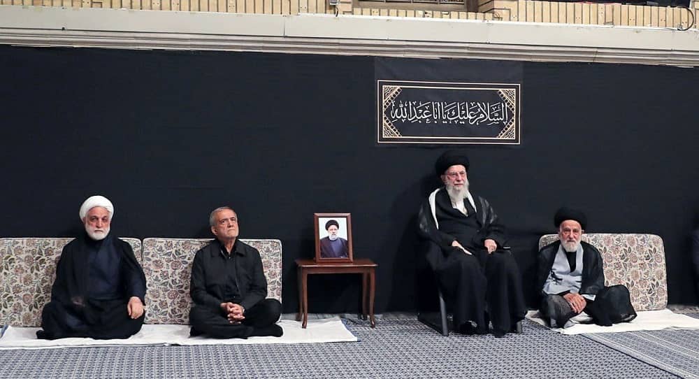 Iranian regime's Supreme Leader Ali Khamenei (right) seated next to his appointed President Masoud Pezeshkian (center) and Judiciary Chief G.H. Mohseni-Ejei (left) at a state-controlled ceremony in July 2024