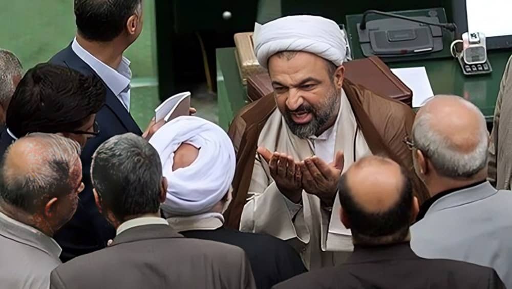 Influencial MP Hamid Rasaee argues with his peers in the Iranian regime's parliament (Majlis)