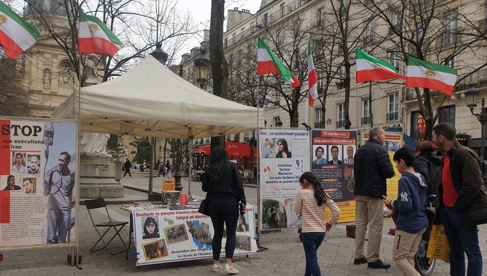 Supporters of the Iranian Resistance in Paris, France, held a bookstand on March 22, 2025