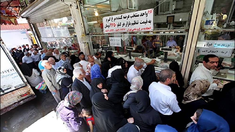 Citizens wait in long lines outside a government-subsidized store in Tehran