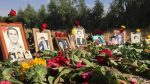 Families of 1988 massacre victims place flowers and photos at Khavaran, a site long known as the burial ground of the regime’s atrocities and fallen freedom fighters
