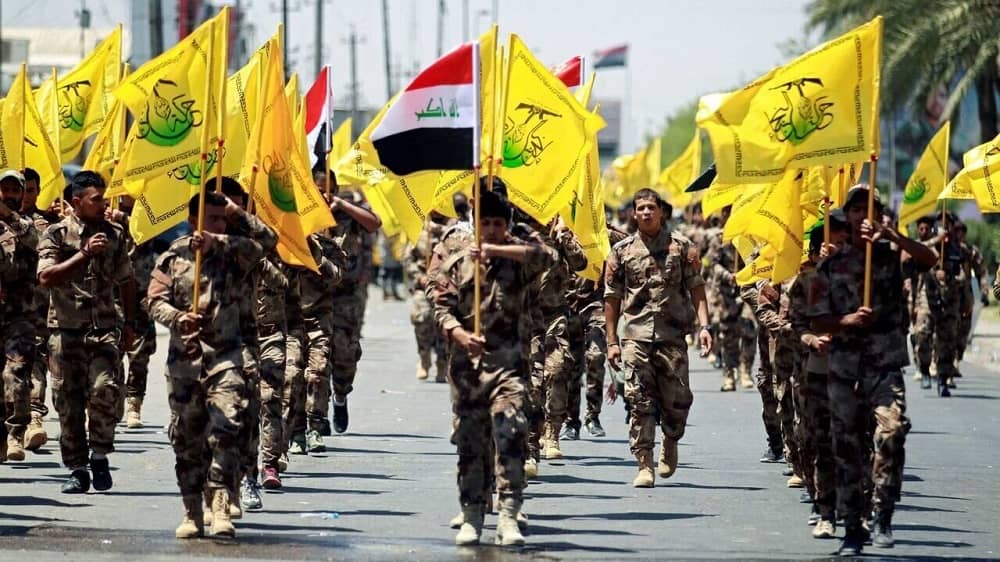 Iraqi militias (Hash al Shaabi) parade through the streets in a show of strength