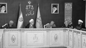 Iranian regime's Judiciary Chief Gholam Hossein Mohseni Ejei (middle) talks with other judicial officials at meeting — May 2025