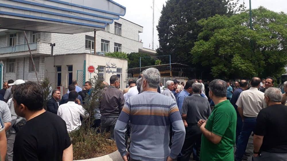 Retired Tehran Bus Company workers protest outside company headquarters on April 30, 2025
