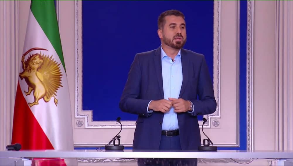 Serdar Yüksel, German MP, addresses an NCRI conference on May 31, 2025
