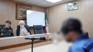 Ahmadreza Radan (left), commander of Iran’s SSF, and Judiciary Chief Gholam-Hosein Mohseni Ejei question an alleged spy during a televised interrogation aired by state media in June 2025