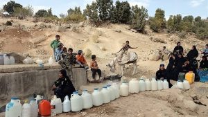 Villagers in Sistan and Baluchestan wait with plastic containers for limited water supplies amid worsening shortages
