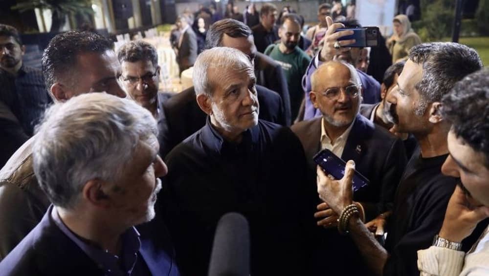 Masoud Pezeshkian, the Iranian regime’s president, surrounded by state-affiliated reporters amid mounting political attacks from rival factions