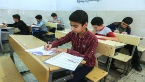 Students at a school in Iran are taking an exam