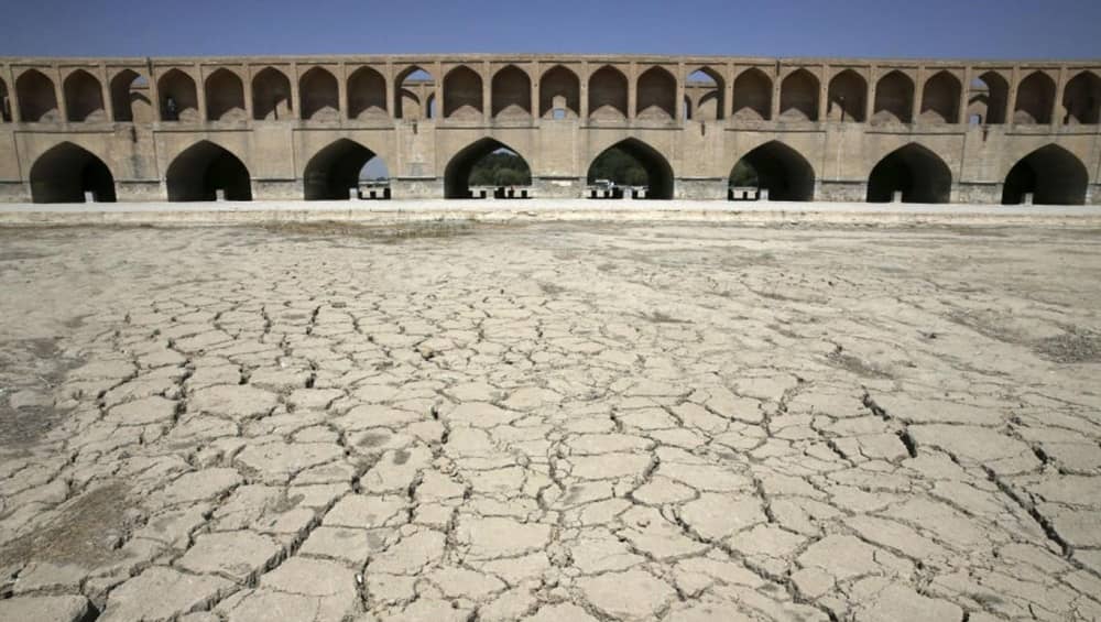 The dry bed of the Zayandeh Rud beneath the historic Si-o-se-pol bridge in Isfahan, once a flowing river and gathering place for the city’s cultural life