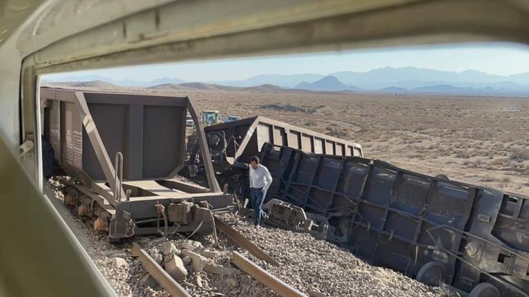 A derailed freight train lies overturned in southern Iran