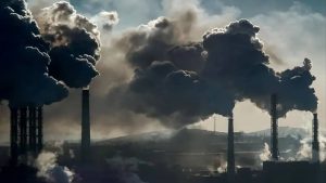 Smoke billows from industrial stacks on the outskirts of an Iranian city during a week of hazardous air pollution