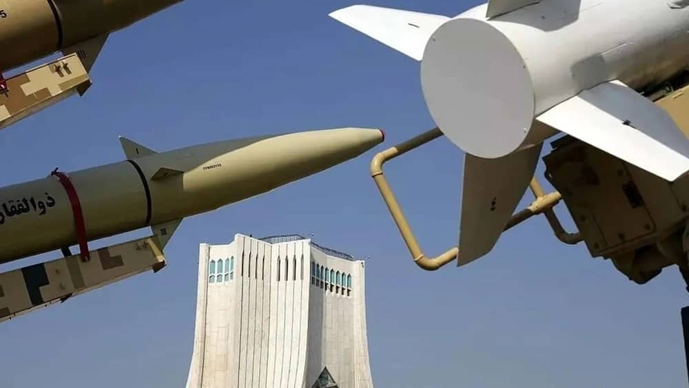 Missiles flank the Azadi Tower during a military parade in Tehran