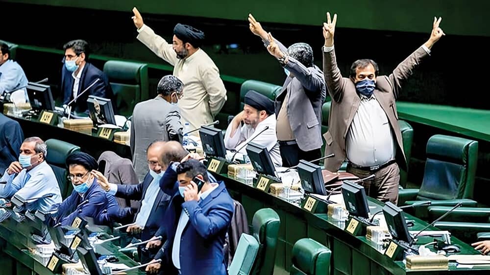 ChatGPT said:Lawmakers gesture and shout across the chamber during a contentious Majles session in Tehran