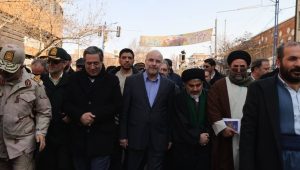 Iranian officials, including parliament speaker Mohammad Bagher Ghalibaf, march in a state-organized anniversary rally in February 11, 2026