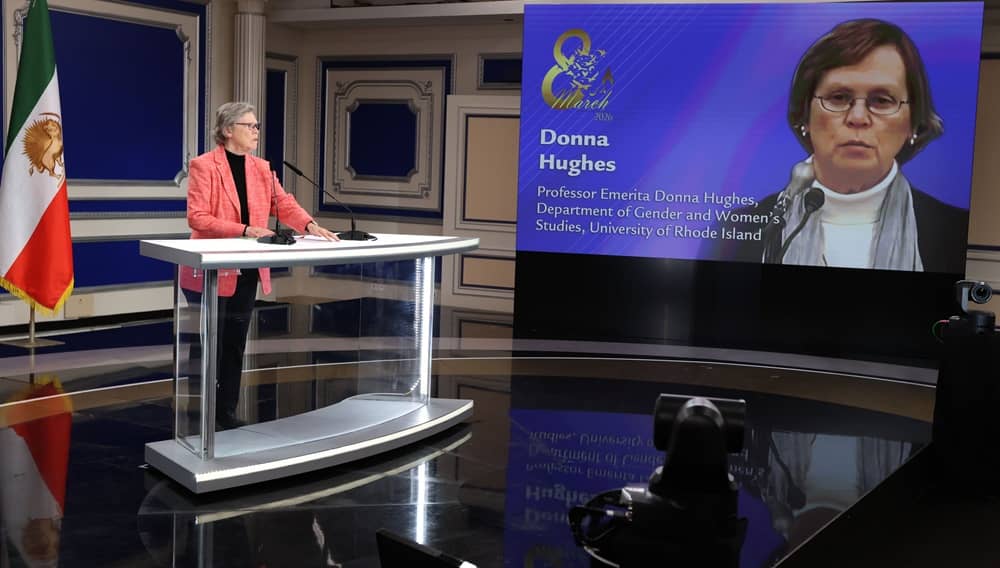 Prof. Donna Hughes addresses an international meeting honoring the 2026 International Women's Day on February 21, 2026