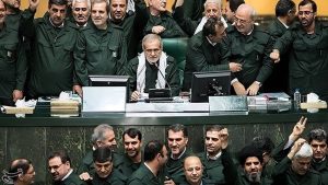 Iranian regime’s president Masoud Pezeshkian and lawmakers pose in their IRGC uniforms inside parliament, signaling loyalty to the ruling system, April 9, 2019