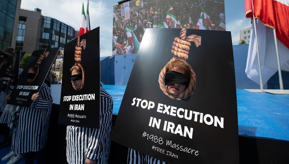 NCRI supporters stage a protest against executions in Iran, highlighting the legacy of the 1988 massacre and calling for accountability and justice