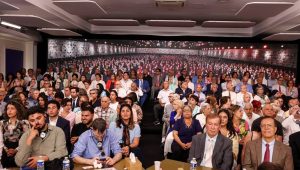 Participants in Paris, joined by residents of Ashraf 3 via video link, listen to international dignitaries at the the Free Iran 2026 World Summit on June 21, 2026