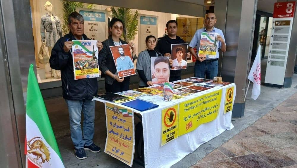 Supporters of the NCRI in Lugano, Switzerland, held a book stall and photo exhibition to protest the execution of PMOI political prisoners—June 6, 2026