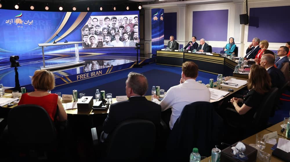 International dignitaries, NCRI members, and supporters watch a video highlighting the execution of political prisoners in Iran during the second day of the Free Iran 2026 Global Summit, June 21, 2026