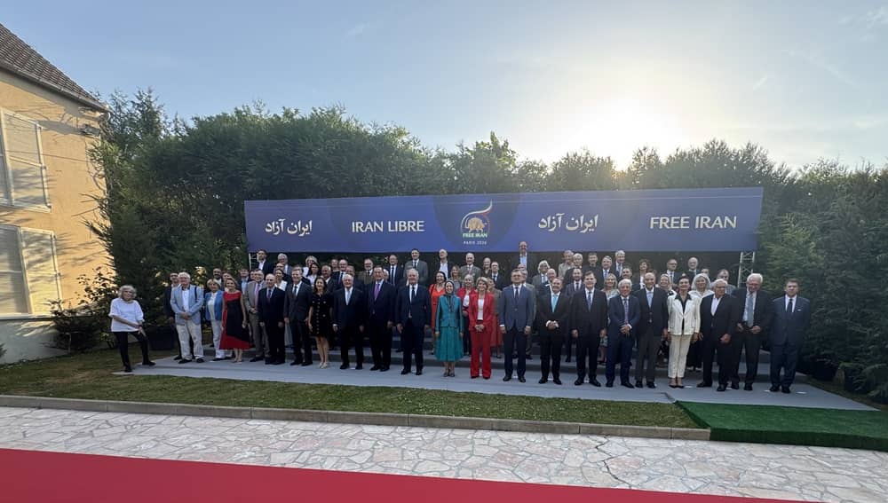 Global leaders and lawmakers pose for a group photo with Mrs. Maryam Rajavi on the sidelines of the Free Iran 2026 World Summit in Paris, June 2026.