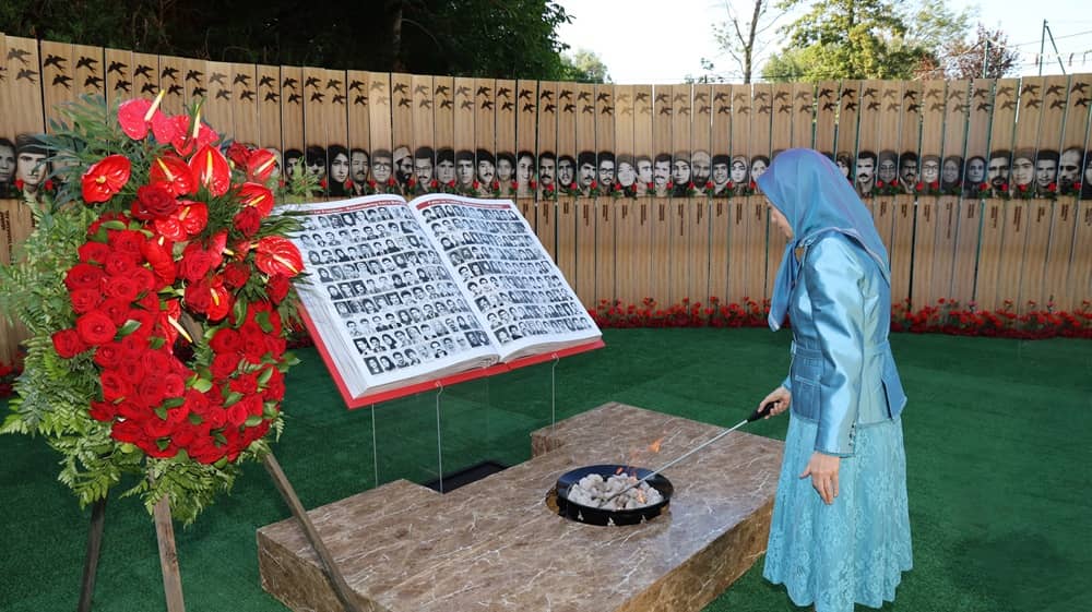 NCRI President-elect Mrs. Maryam Rajavi lights candles at a monument honoring the martyrs of the struggle for Iran's freedom on June 20, 2026