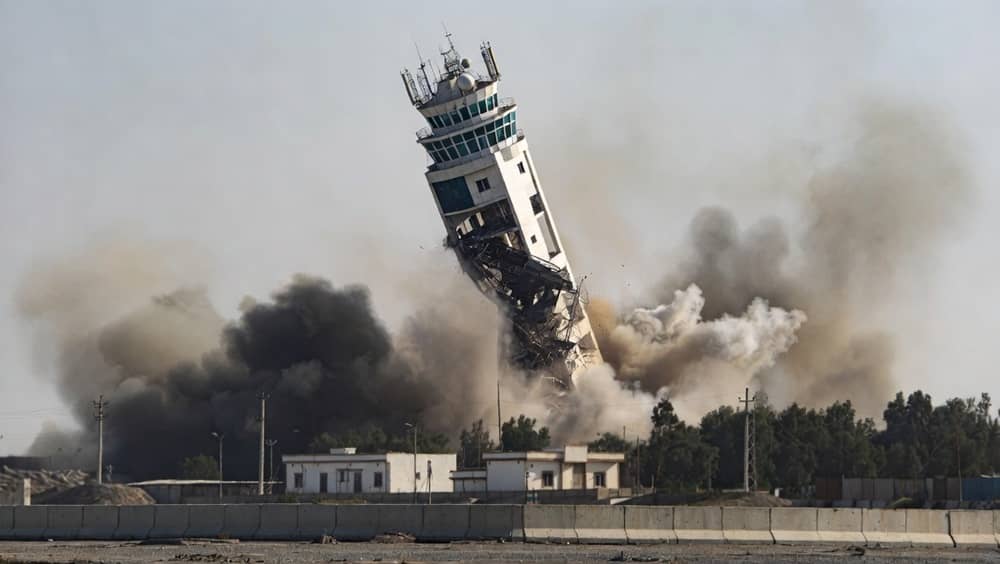 Chabahar, Iran – July 16, 2026: AI-generated reconstruction based on real-life footage of the maritime control tower at Shahid Kalantari Port collapsing after a U.S. airstrike