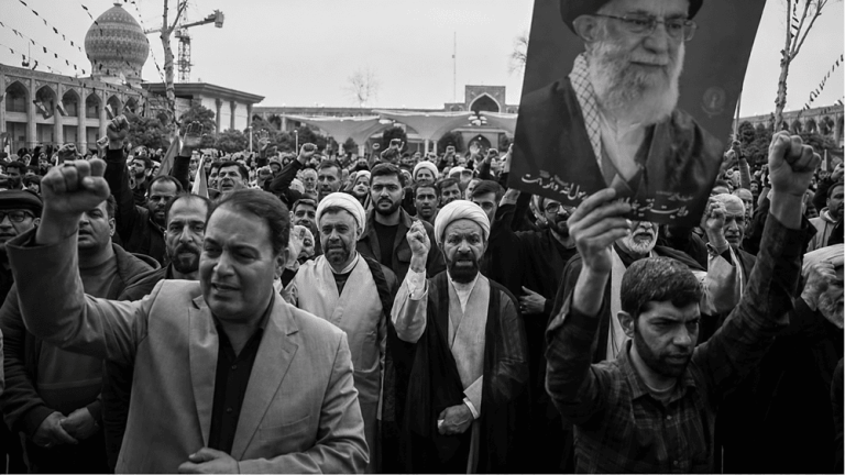 State-aligned mourners in Shiraz gather at the Shah Cheragh Shrine to commemorate the death of Ali Khamenei during a public mourning ceremony – March 1, 2026