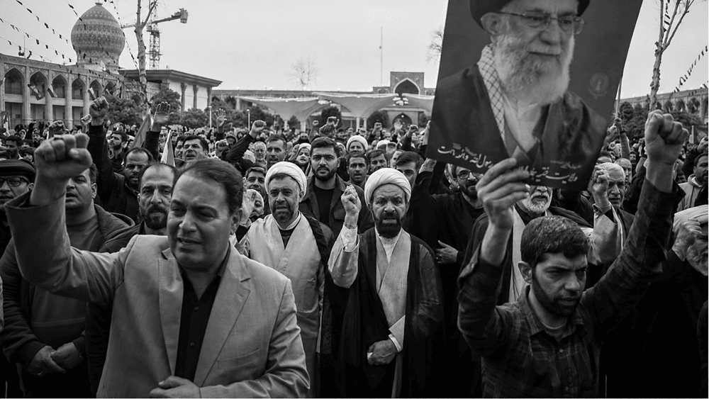 State-aligned mourners in Shiraz gather at the Shah Cheragh Shrine to commemorate the death of Ali Khamenei during a public mourning ceremony – March 1, 2026
