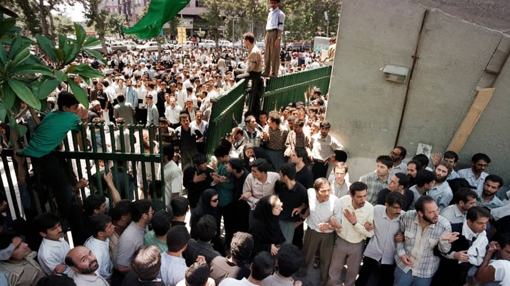Students and protesters gather at the university gates during the intense demonstrations of the July 1999 student uprising in Tehran
