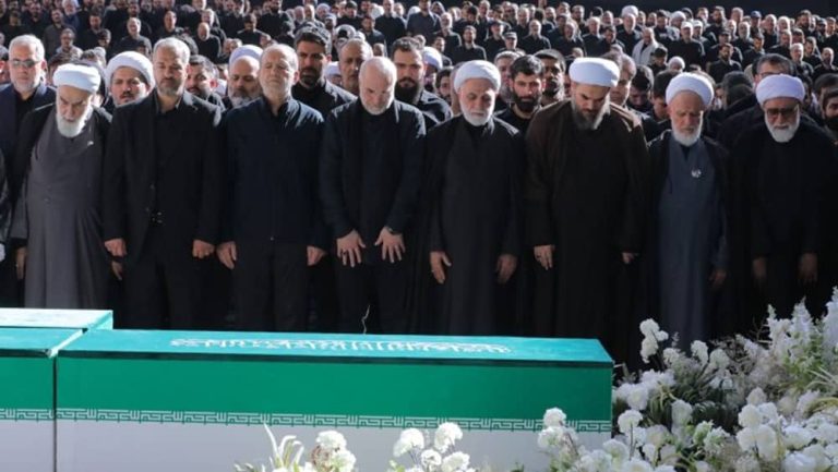 High-ranking Iranian officials stand in a line during the state-staged funeral ceremony for Ali Khamenei— July 5, 2026