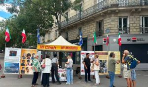 NCRI supporters in Paris, France, set up a book table and photo exhibition condemning the execution of political prisoners on August 5, 2026