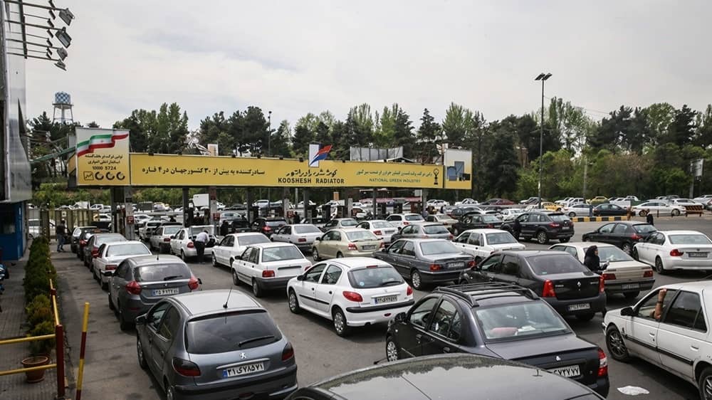 Cars queue at a fuel station in Iran