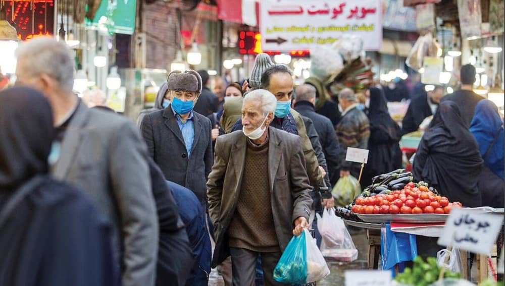 People shop at a crowded market in Tehran, Iran, amid rising living costs and economic pressures
