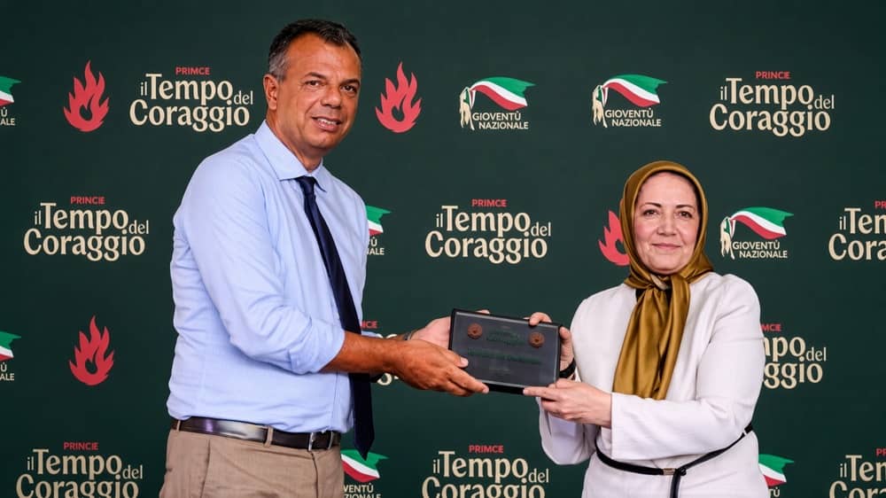 Italian Senator Marco Scurria presents the Courage Award to Sarvnaz Chitsaz, Chair of the NCRI Women’s Committee, at the Fenix Festival in Rome on 18 September 2026