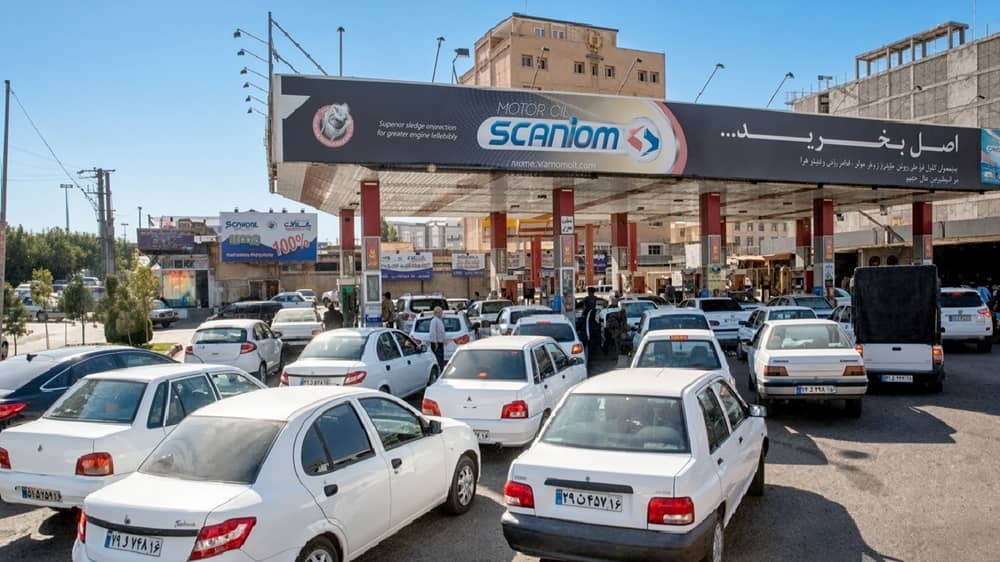 Busy queues at an Iranian gas station as drivers wait under the SCANIOM canopy