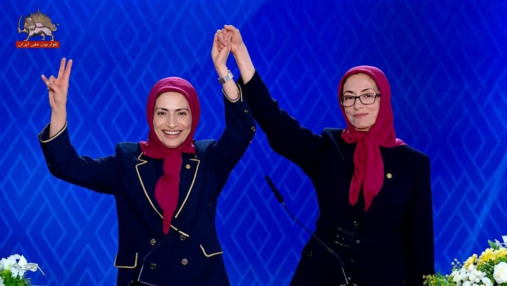 Former PMOI Secretary-General Zahra Merrikhi raises the hand of newly elected Secretary-General Mahnaz Maimanat at the final voting session, September 6, 2026