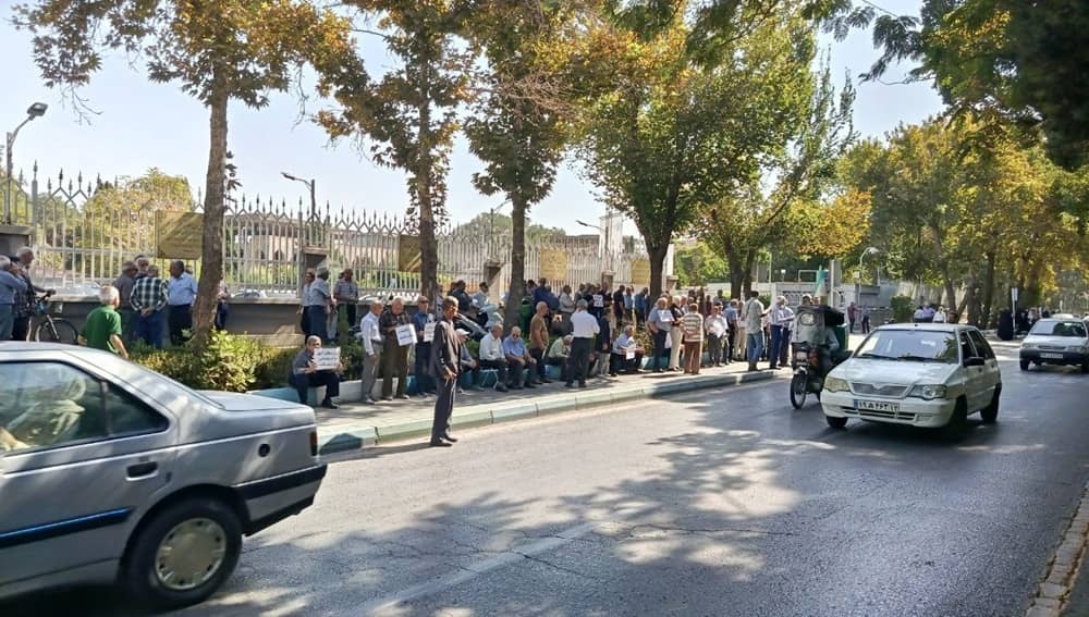 Retired steel factory workers gather along a street in Isfahan, Iran, on October 11, 2026, to protest inadequate pensions and worsening living conditions
